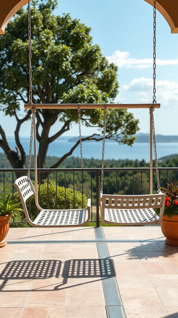 Two white swinging chairs on a patio overlooking a scenic view