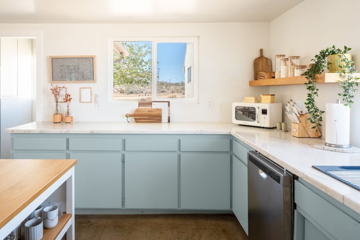 Desert-Inspired Sage Blue Kitchen with Open Shelving - best blue kitchens