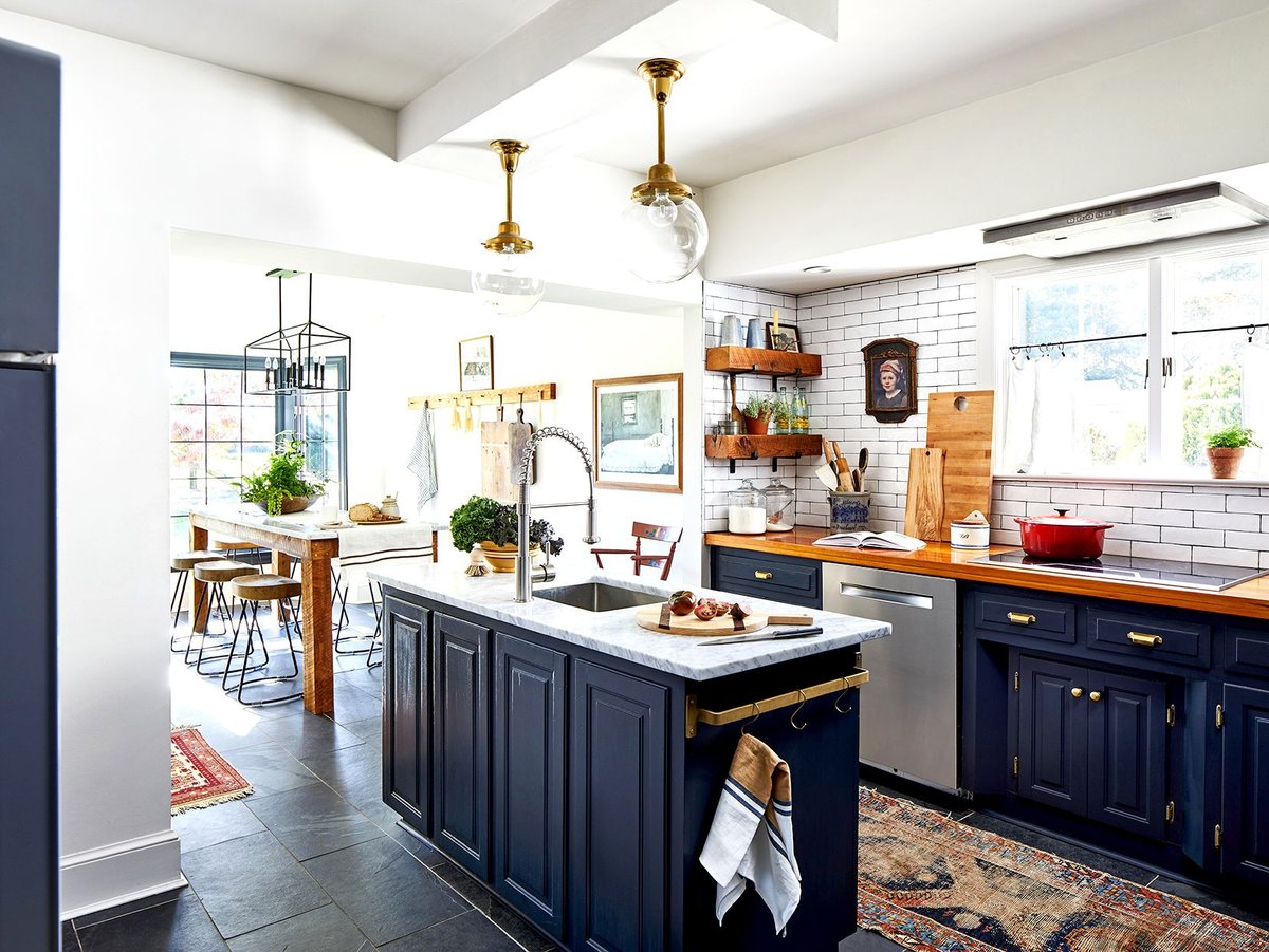 Farmhouse Kitchen with Navy Blue Cabinets and Warm Wood Tones - best blue kitchens