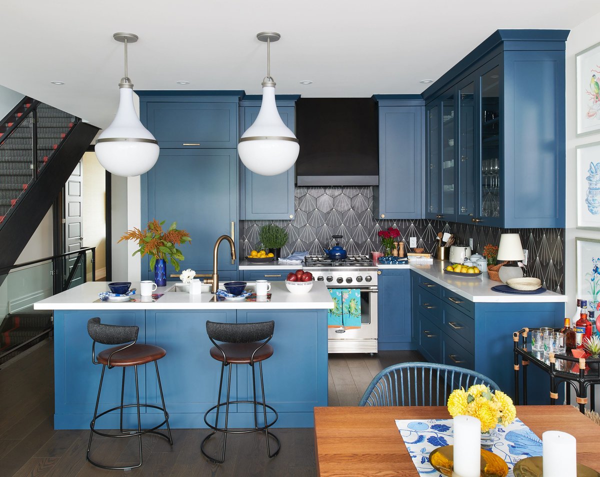 Vibrant Ocean Blue Cabinetry with Geometric Backsplash - best blue kitchens