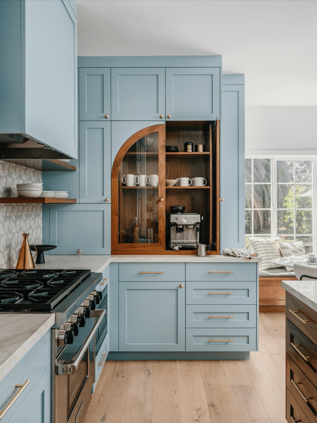 Airy Sky Blue Kitchen with Arched Wood Detail - best blue kitchens
