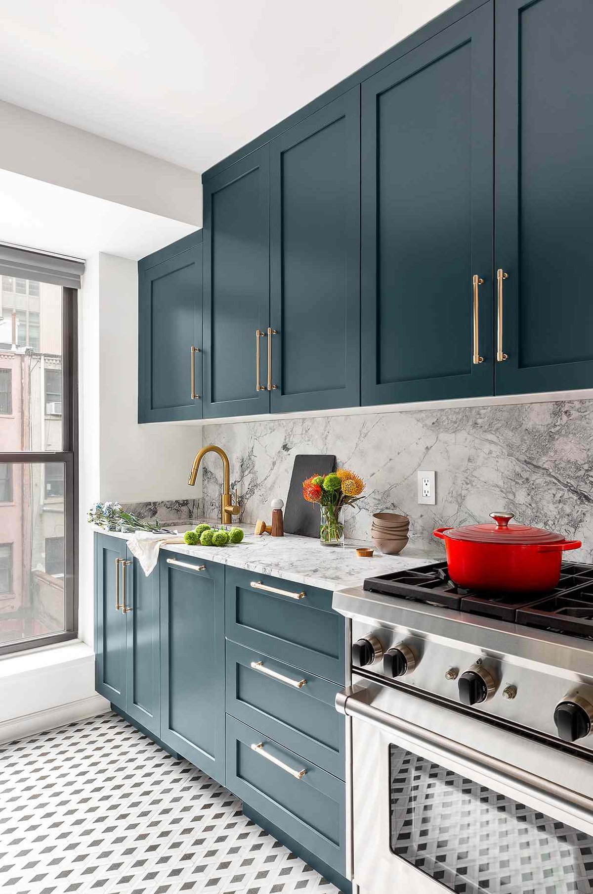 Deep Teal Cabinets with Marble and Brass Accents - best blue kitchens