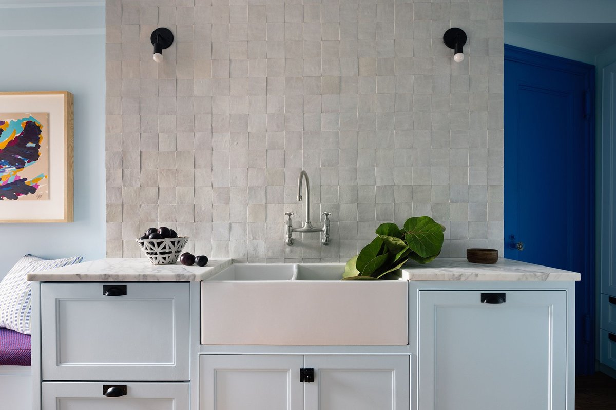 Light Blue Cabinetry with Textured Backsplash - best blue kitchens
