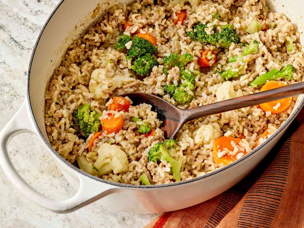 Hearty Cooked Meal in a White Dutch Oven - Homemade dog food recipes